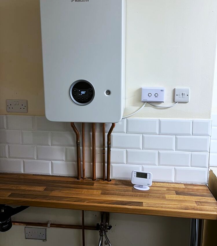 Gas Safe engineer servicing a boiler in Birmingham by K1 Heating Solution Ltd